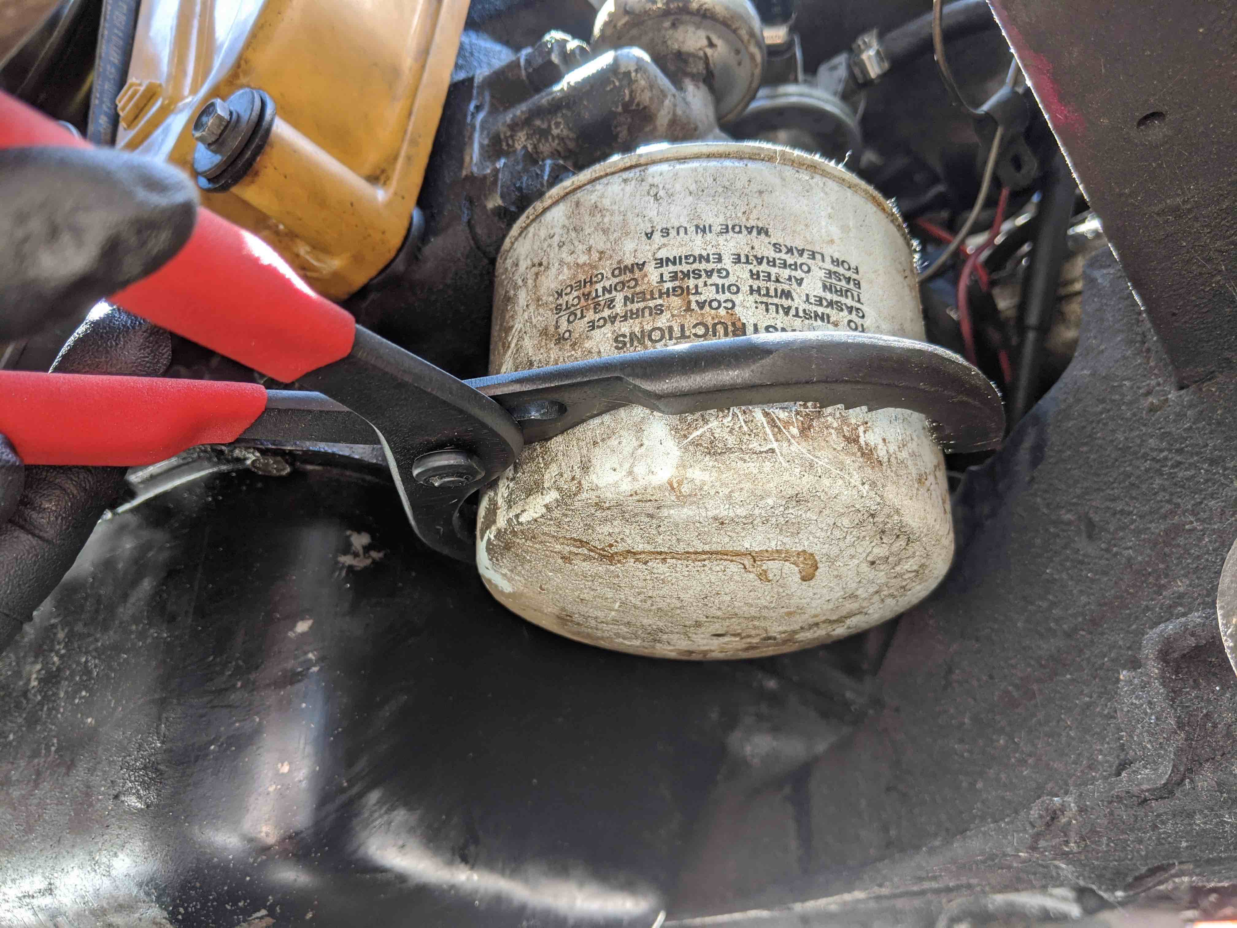 Loosening oil filter with pliers
